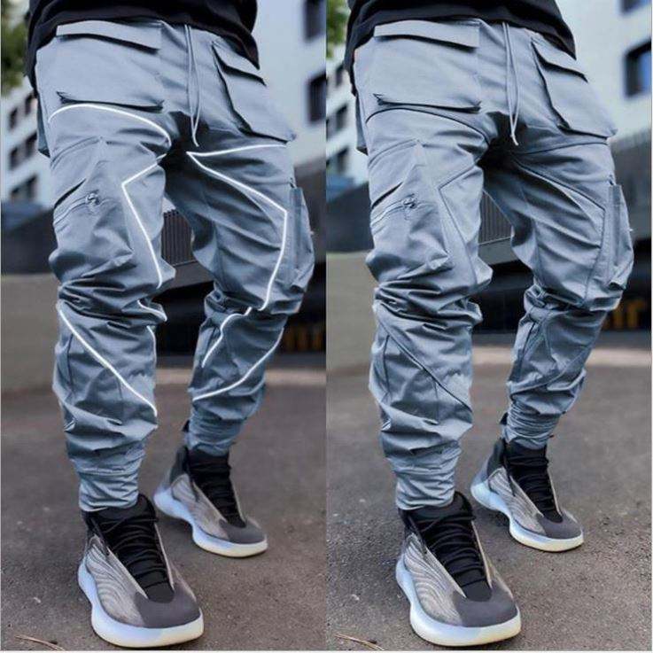 Pantalones de nylon de secado rápido de los pantalones de nylon del cargo de los hombres reflexivos del diseño de la tira del fabricante del OEM